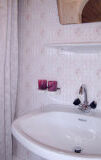 a close up of pink tub and sink